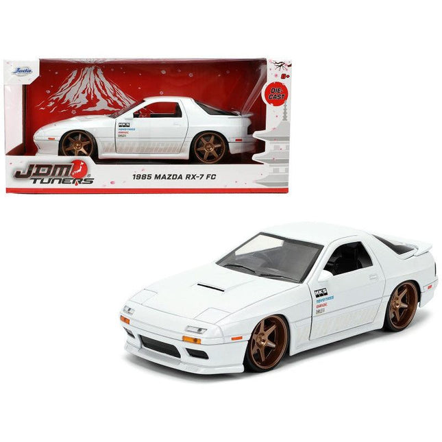 https://cdn.shopify.com/s/files/1/0504/9925/6496/files/1985-mazda-rx-7-white-jdm-tuners-series-124-diecast-model-car-by-jada-444877.jpg?v=1756087217