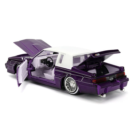 https://cdn.shopify.com/s/files/1/0504/9925/6496/files/1987-buick-grand-national-candy-purple-with-graphics-and-white-top-and-interior-bigtime-muscle-series-124-diecast-model-car-by-jada-275418.jpg?v=1756086813