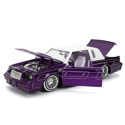 https://cdn.shopify.com/s/files/1/0504/9925/6496/files/1987-buick-grand-national-candy-purple-with-graphics-and-white-top-and-interior-bigtime-muscle-series-124-diecast-model-car-by-jada-361031.jpg?v=1756086814