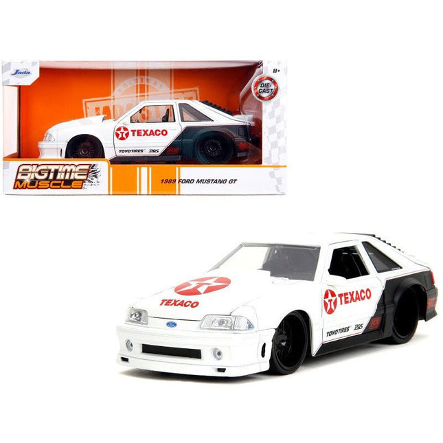 https://cdn.shopify.com/s/files/1/0504/9925/6496/files/1989-ford-mustang-gt-texaco-white-and-matt-black-with-graphics-bigtime-muscle-series-124-diecast-model-car-by-jada-616226.jpg?v=1756087353