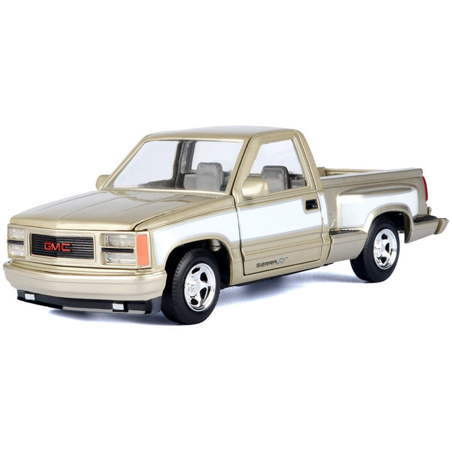 https://cdn.shopify.com/s/files/1/0504/9925/6496/files/1992-gmc-sierra-gt-pickup-truck-gold-metallic-with-white-sides-american-classics-series-124-diecast-model-car-by-motormax-436670.jpg?v=1748405358