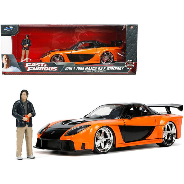 https://cdn.shopify.com/s/files/1/0504/9925/6496/files/1995-mazda-rx-7-widebody-rhd-right-hand-drive-orange-metallic-and-black-with-han-diecast-figurine-the-fast-and-the-furious-tokyo-drift-2006-movie-124-diecast-mo-950096.jpg?v=1748419223
