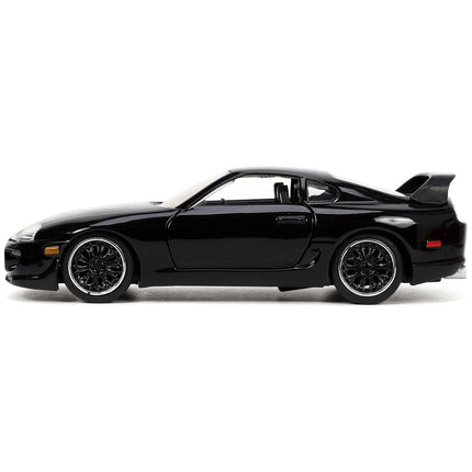 https://cdn.shopify.com/s/files/1/0504/9925/6496/files/1995-toyota-supra-black-fast-furious-movie-132-diecast-model-car-by-jada-844706.jpg?v=1748419124
