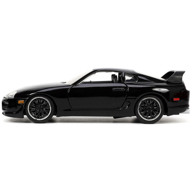 https://cdn.shopify.com/s/files/1/0504/9925/6496/files/1995-toyota-supra-black-fast-furious-movie-132-diecast-model-car-by-jada-844706.jpg?v=1748419124