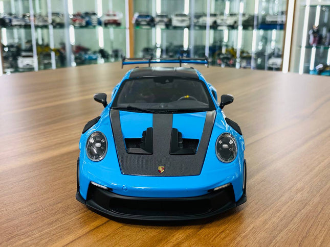 Minichamps 1/18 Porsche 911 GT3 RS 2024 Blue Diecast Model - studio product photo of the scale model