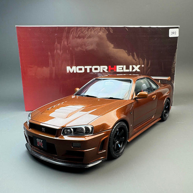 Motorhelix Nissan GT-R R34 Metallic Bronze 1:18 Diecast Model Car - studio product photo of the scale model