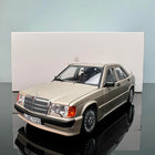 Norev Mercedes-Benz 190E 2.3-16 1984 Gold 1:18 Diecast Model Car - studio product photo of the scale model