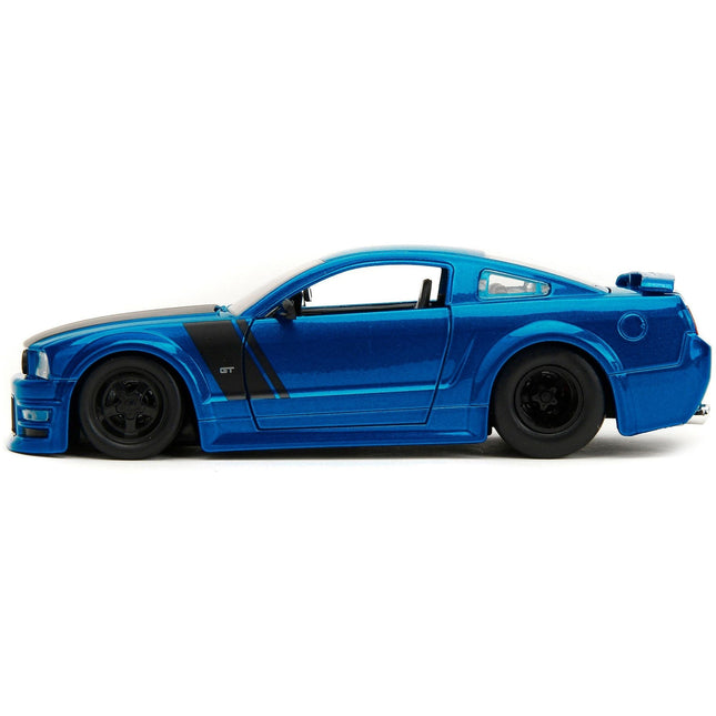 https://cdn.shopify.com/s/files/1/0504/9925/6496/files/2006-ford-mustang-gt-blue-metallic-with-matt-black-hood-and-stripes-bigtime-muscle-series-124-diecast-model-car-by-jada-294942.jpg?v=1748419122