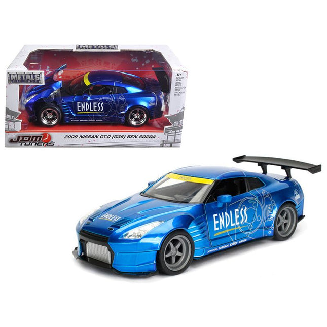 https://cdn.shopify.com/s/files/1/0504/9925/6496/files/2009-nissan-gt-r-r35-ben-sopra-blue-jdm-tuners-124-diecast-model-car-by-jada-759705.jpg?v=1748419596