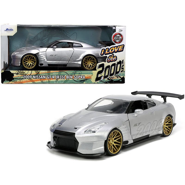 https://cdn.shopify.com/s/files/1/0504/9925/6496/files/2009-nissan-gt-r-r35-ben-sopra-silver-i-love-the-2000s-series-124-diecast-model-car-by-jada-664498.jpg?v=1748419222