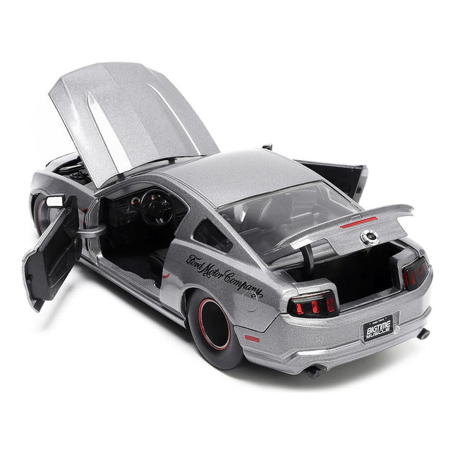 https://cdn.shopify.com/s/files/1/0504/9925/6496/files/2010-ford-mustang-gt-gray-metallic-with-flames-ford-motor-company-bigtime-muscle-series-124-diecast-model-car-by-jada-905926.jpg?v=1748419130