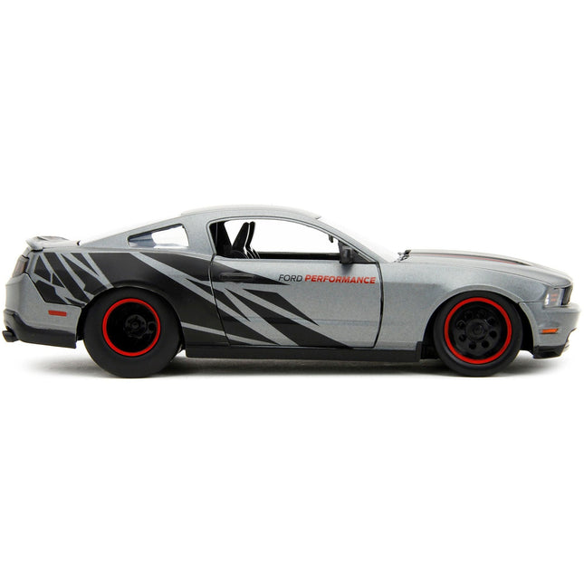 https://cdn.shopify.com/s/files/1/0504/9925/6496/files/2010-ford-mustang-gt-matt-gray-metallic-with-black-graphics-and-stripes-ford-performance-bigtime-muscle-series-124-diecast-model-car-by-jada-805807.jpg?v=1748419122