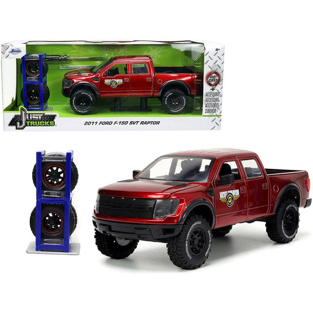 https://cdn.shopify.com/s/files/1/0504/9925/6496/files/2011-ford-f-150-svt-raptor-pickup-truck-candy-red-metallic-mickey-thompson-tires-wheels-with-extra-wheels-just-trucks-series-124-diecast-model-car-by-jada-913363.jpg?v=1748419220