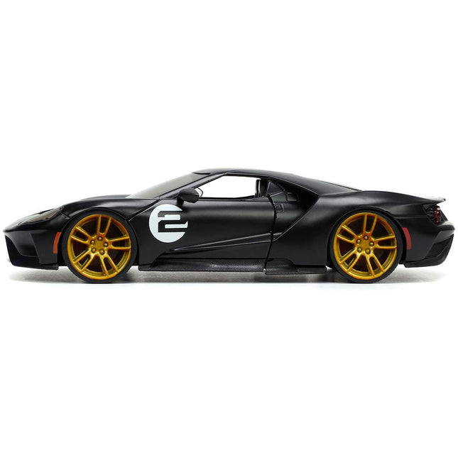 https://cdn.shopify.com/s/files/1/0504/9925/6496/files/2017-ford-gt-2-matt-black-with-silver-stripes-and-gold-wheels-bigtime-muscle-series-124-diecast-model-car-by-jada-582972.jpg?v=1748419220