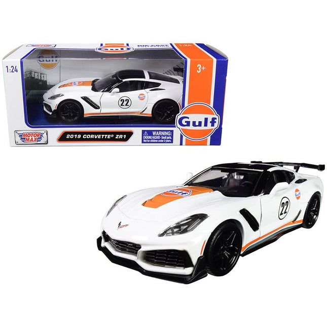https://cdn.shopify.com/s/files/1/0504/9925/6496/files/2019-chevrolet-corvette-zr1-22-gulf-oil-white-with-orange-stripes-and-black-top-124-diecast-model-car-by-motormax-679658.jpg?v=1748418127