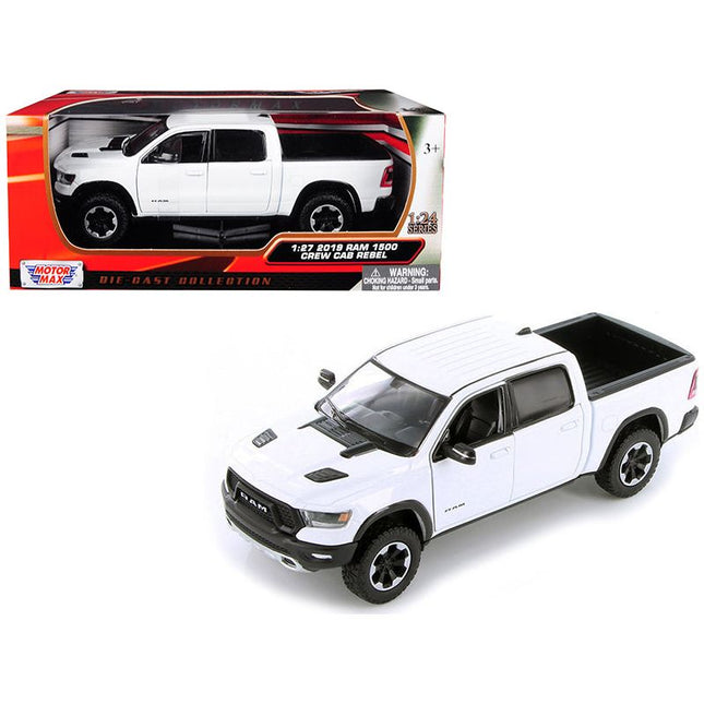 https://cdn.shopify.com/s/files/1/0504/9925/6496/files/2019-ram-1500-rebel-crew-cab-pickup-truck-white-124-127-diecast-model-car-by-motormax-318574.jpg?v=1748418128