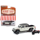 https://cdn.shopify.com/s/files/1/0504/9925/6496/files/2020-jeep-gladiator-rubicon-pickup-truck-beige-with-black-top-and-2020-indian-scout-bobber-icon-series-motorcycle-red-the-hobby-shop-series-12-164-diecast-model-603310.jpg?v=1748405568