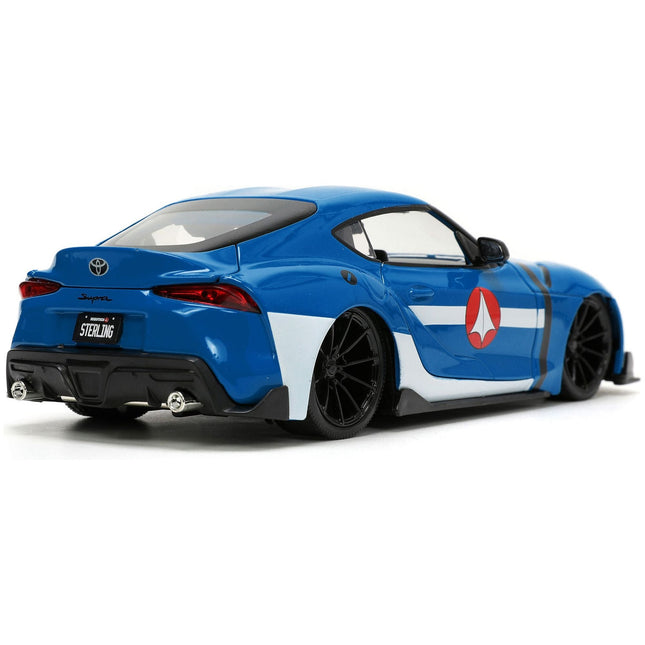 https://cdn.shopify.com/s/files/1/0504/9925/6496/files/2020-toyota-supra-blue-with-graphics-and-max-sterling-diecast-figurine-robotech-hollywood-rides-series-124-diecast-model-car-by-jada-595082.jpg?v=1748419126