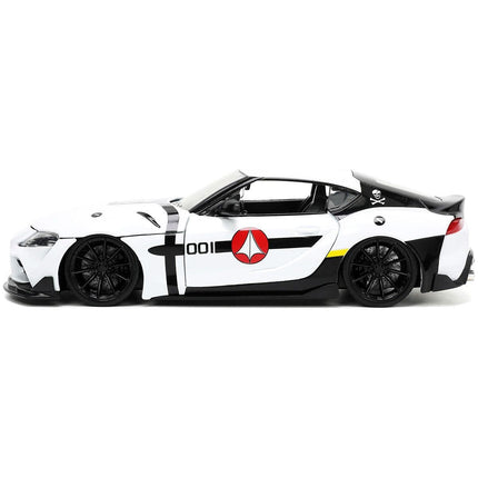 https://cdn.shopify.com/s/files/1/0504/9925/6496/files/2020-toyota-supra-white-and-roy-focker-diecast-figurine-robotech-hollywood-rides-series-124-diecast-model-car-by-jada-371394.jpg?v=1748419222