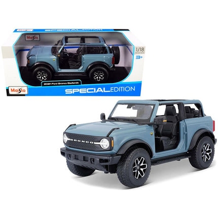 https://cdn.shopify.com/s/files/1/0504/9925/6496/files/2021-ford-bronco-badlands-blue-special-edition-118-diecast-model-car-by-maisto-488883.jpg?v=1748418505