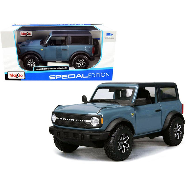 https://cdn.shopify.com/s/files/1/0504/9925/6496/files/2021-ford-bronco-badlands-blue-with-black-top-special-edition-124-diecast-model-car-by-maisto-164730.jpg?v=1748404887