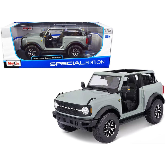 https://cdn.shopify.com/s/files/1/0504/9925/6496/files/2021-ford-bronco-badlands-light-gray-special-edition-118-diecast-model-car-by-maisto-676234.jpg?v=1748418505