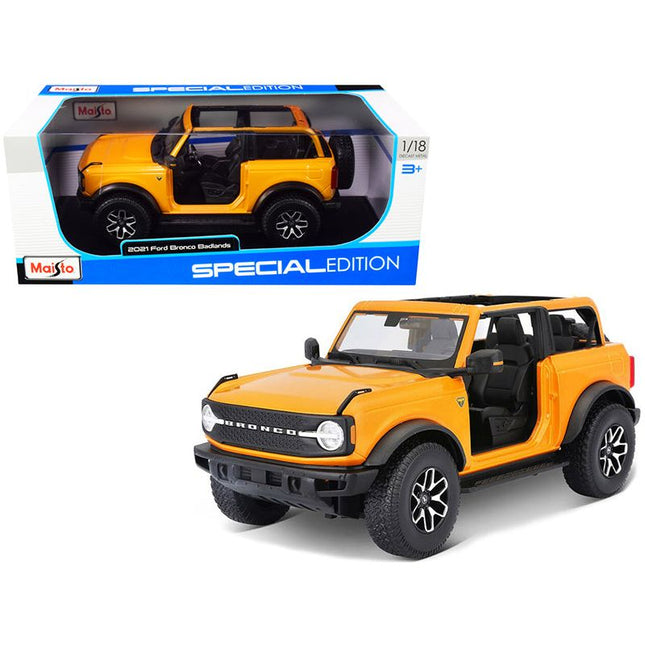 https://cdn.shopify.com/s/files/1/0504/9925/6496/files/2021-ford-bronco-badlands-orange-metallic-special-edition-118-diecast-model-car-by-maisto-671210.jpg?v=1748418505