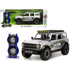 https://cdn.shopify.com/s/files/1/0504/9925/6496/files/2021-ford-bronco-gray-metallic-kc-hilites-with-extra-wheels-just-trucks-series-124-diecast-model-car-by-jada-709038.jpg?v=1748419222