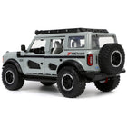 https://cdn.shopify.com/s/files/1/0504/9925/6496/files/2021-ford-bronco-gray-with-black-stripes-with-roof-rack-own-the-night-just-trucks-series-124-diecast-model-car-by-jada-744876.jpg?v=1748419128