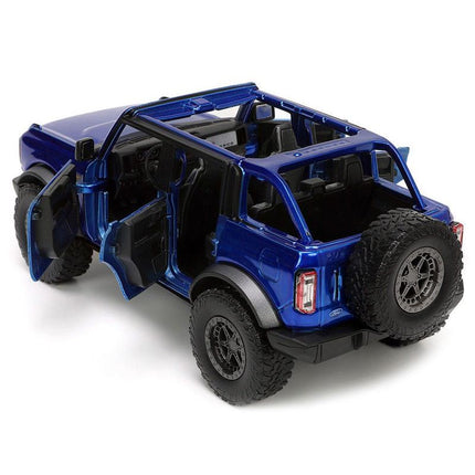 https://cdn.shopify.com/s/files/1/0504/9925/6496/files/2021-ford-bronco-open-top-candy-blue-metallic-with-extra-wheels-just-trucks-series-124-diecast-model-car-by-jada-355271.jpg?v=1756087217