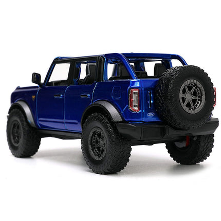 https://cdn.shopify.com/s/files/1/0504/9925/6496/files/2021-ford-bronco-open-top-candy-blue-metallic-with-extra-wheels-just-trucks-series-124-diecast-model-car-by-jada-532313.jpg?v=1756087219