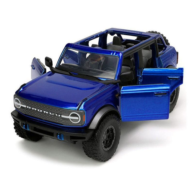 https://cdn.shopify.com/s/files/1/0504/9925/6496/files/2021-ford-bronco-open-top-candy-blue-metallic-with-extra-wheels-just-trucks-series-124-diecast-model-car-by-jada-901555.jpg?v=1756087218