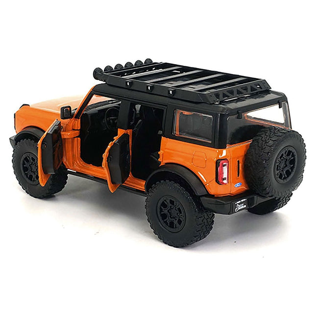 https://cdn.shopify.com/s/files/1/0504/9925/6496/files/2021-ford-bronco-orange-with-black-stripes-and-roof-rack-just-trucks-series-124-diecast-model-car-by-jada-770954.jpg?v=1748419131