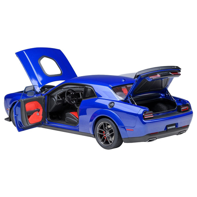 https://cdn.shopify.com/s/files/1/0504/9925/6496/files/2022-dodge-challenger-rt-scat-pack-widebody-indigo-blue-118-model-car-by-autoart-264060.jpg?v=1748416526