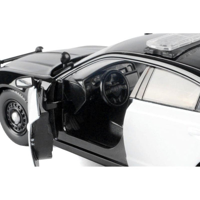 https://cdn.shopify.com/s/files/1/0504/9925/6496/files/2023-dodge-charger-pursuit-police-car-black-and-white-law-enforcement-and-public-service-series-124-diecast-model-car-by-motormax-739298.jpg?v=1756086898