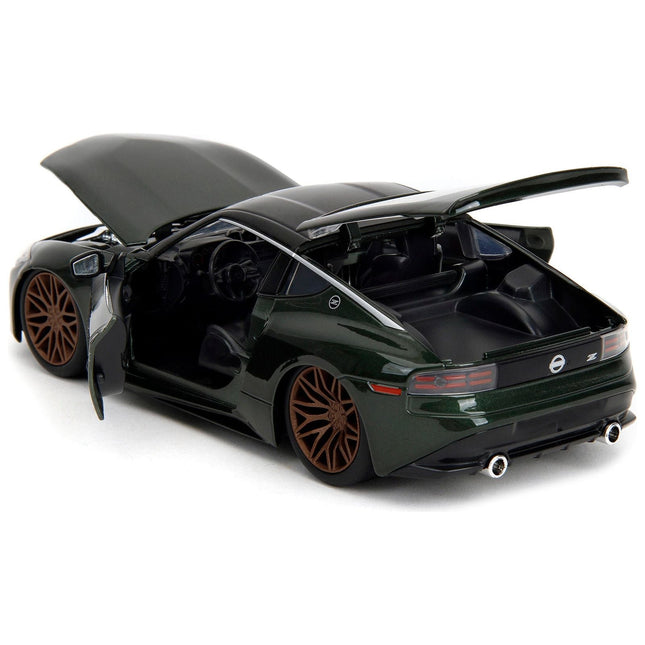 https://cdn.shopify.com/s/files/1/0504/9925/6496/files/2023-nissan-z-dark-green-metallic-with-black-top-fast-x-2023-movie-fast-furious-series-124-diecast-model-car-by-jada-210413.jpg?v=1748419023