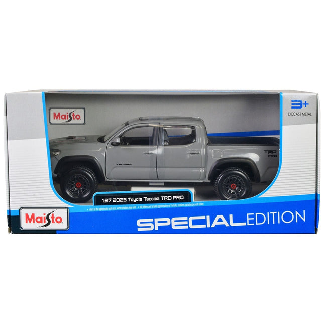 https://cdn.shopify.com/s/files/1/0504/9925/6496/files/2023-toyota-tacoma-trd-pro-pickup-truck-gray-with-sunroof-special-edition-series-127-diecast-model-car-by-maisto-671935.jpg?v=1748405110