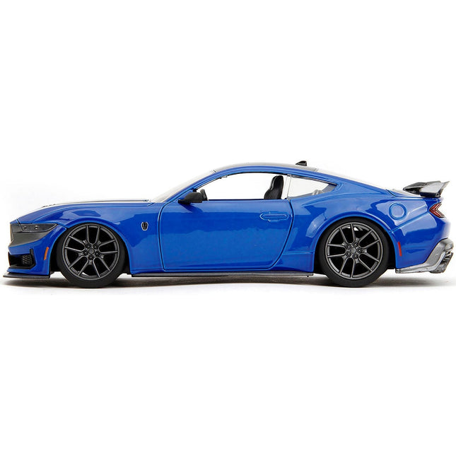 https://cdn.shopify.com/s/files/1/0504/9925/6496/files/2024-ford-mustang-dark-horse-blue-metallic-with-black-and-gray-stripes-bigtime-muscle-series-124-diecast-model-car-by-jada-592525.jpg?v=1748405123