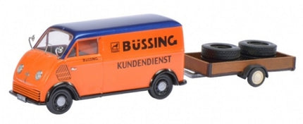 Orange and blue Büssing Kundendienst model van with trailer carrying two spare tires