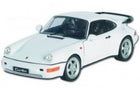1:18 scale white diecast Porsche sports car model with black interior and rear spoiler
