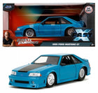 1:24 scale diecast 1989 Ford Mustang GT model car in blue with Fast & Furious packaging.