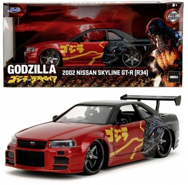 Diecast 2002 Nissan Skyline GT-R R34 model car with Godzilla graphics, red and black livery.