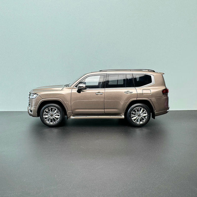 LCD Model Toyota Land Cruiser LC300 ZX Gold 1:18 Diecast Model Car - studio product photo of the scale model