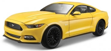 yellow diecast model car, 1:18 scale, sports coupe with black wheels, isolated on white