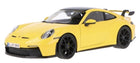 Yellow diecast model car 1:18 scale, sports coupe with black wheels and rear wing