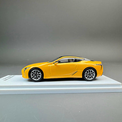 Almost Real Lexus LC500 2018 Yellow 1:64 Diecast Model Car - studio product photo of the scale model