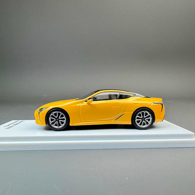 Almost Real Lexus LC500 2018 Yellow 1:64 Diecast Model Car - studio product photo of the scale model