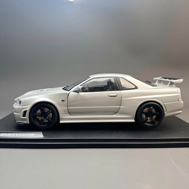 Solido Nissan GT-R R34 Z-Tune Silver 1:18 Diecast Model Car - studio product photo of the scale model
