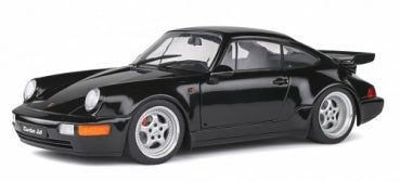 Black Porsche diecast model car 1:18 scale with silver wheels, side view