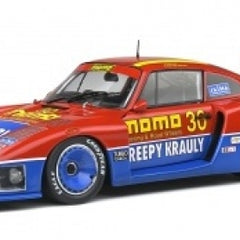 1:18 scale red and blue diecast race car model with detailed sponsor decals and rear wing